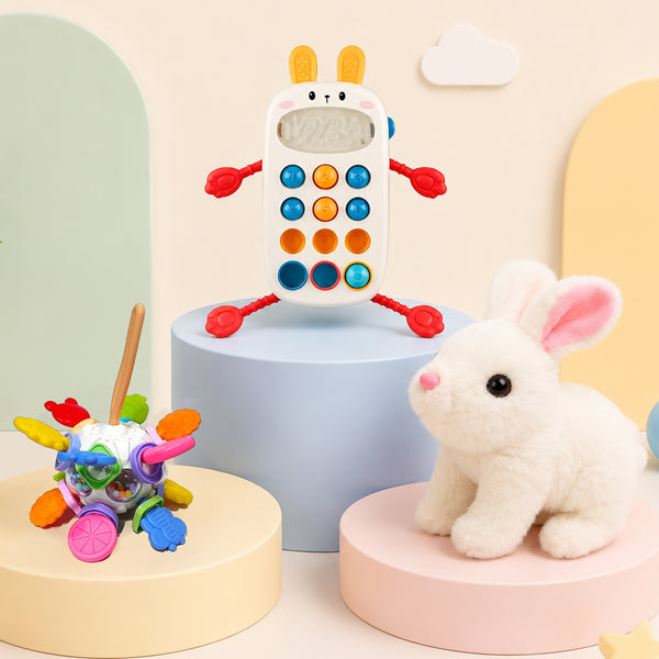 Baby gift hamper of three sensory toys including a soft hopping bunny