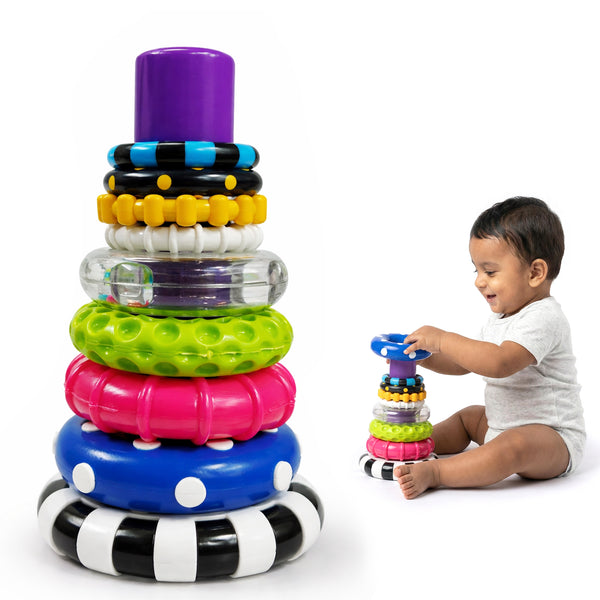 Stacking ring toy with graded coloured rings on a central post and a rattle base